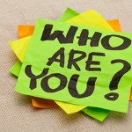 Who are you question - handwriting on a green sticky note